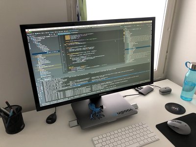 open source laptop setup with coding screen
