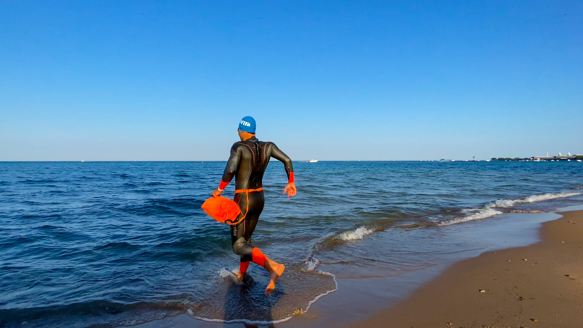 open water swim equipment on a beach