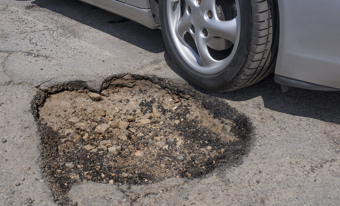 pothole road surface damage car tires