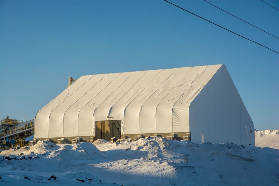 Large engineered dome structure covering a stockpile