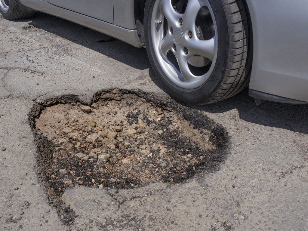 pothole road vehicle tire