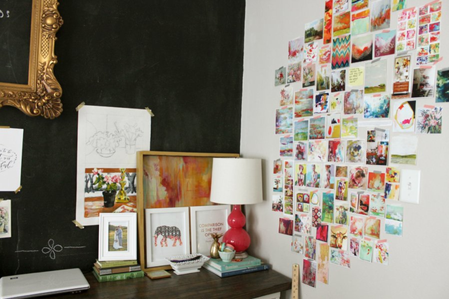 Artist's desk with inspiration wall showing various materials and sketches