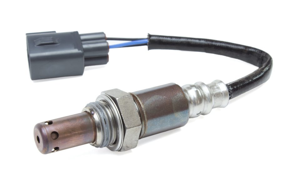 A typical oxygen sensor and its electrical connector, prone to damage or corrosion.