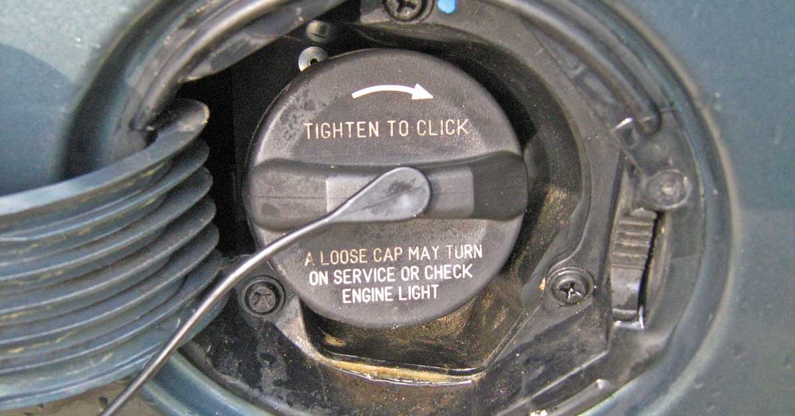 A close-up of a fuel filler neck and gas cap, emphasizing the importance of a good seal.