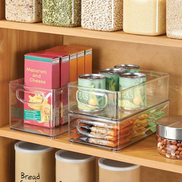 Clear plastic storage bins with handles, suitable for pantry organization.