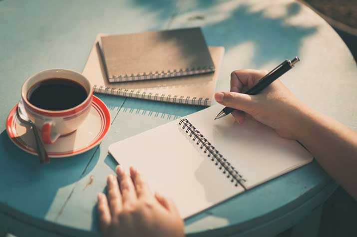 notebook, pen, and written notes on paper