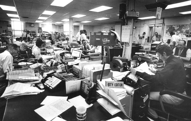newsroom and newspapers