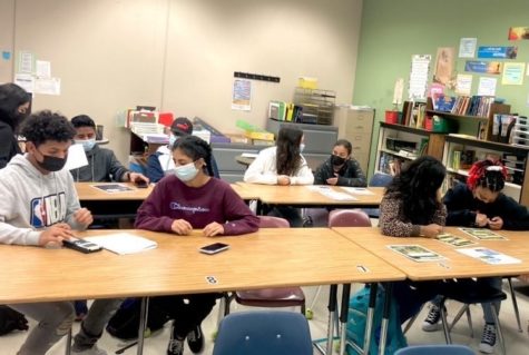 students peer tutoring session classroom