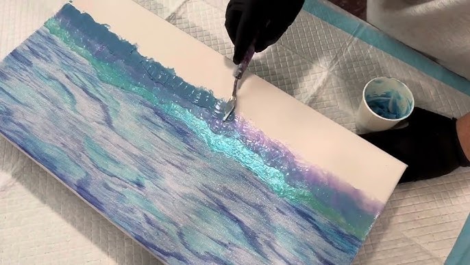 artist mixing pigments on canvas