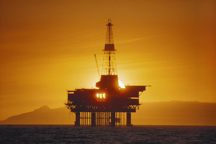 oil rig on offshore platform at sunset