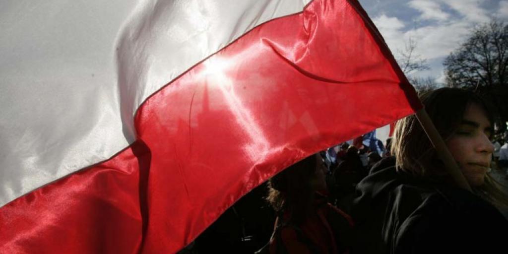 Polish political rally, national symbols, traditional architecture