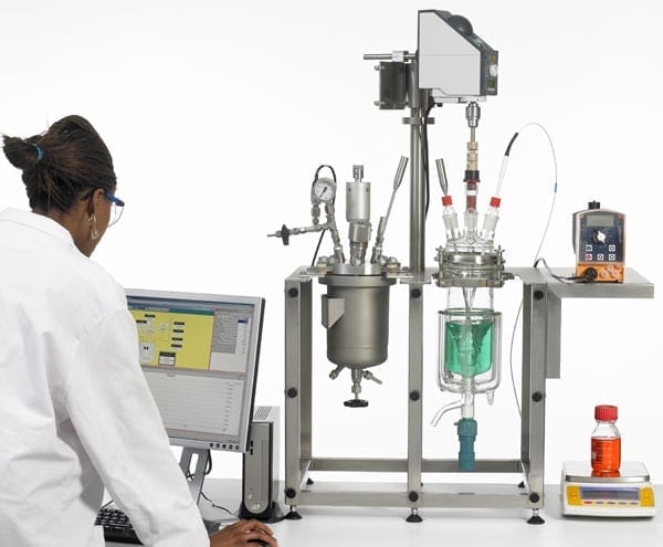 chemical lab setup with reaction vessels and polymers