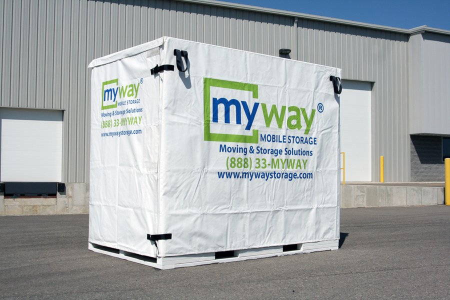 Portable storage container in a residential driveway ready for loading
