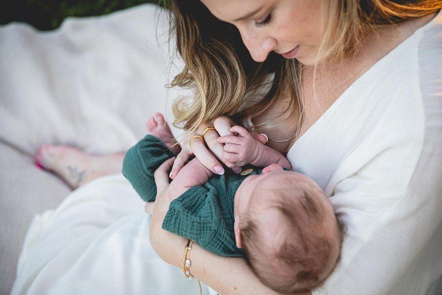 newborn care mother outdoors