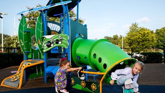 children playing in a preschool playground