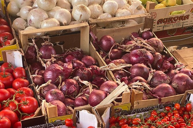 colorful market stalls with onions and potatoes