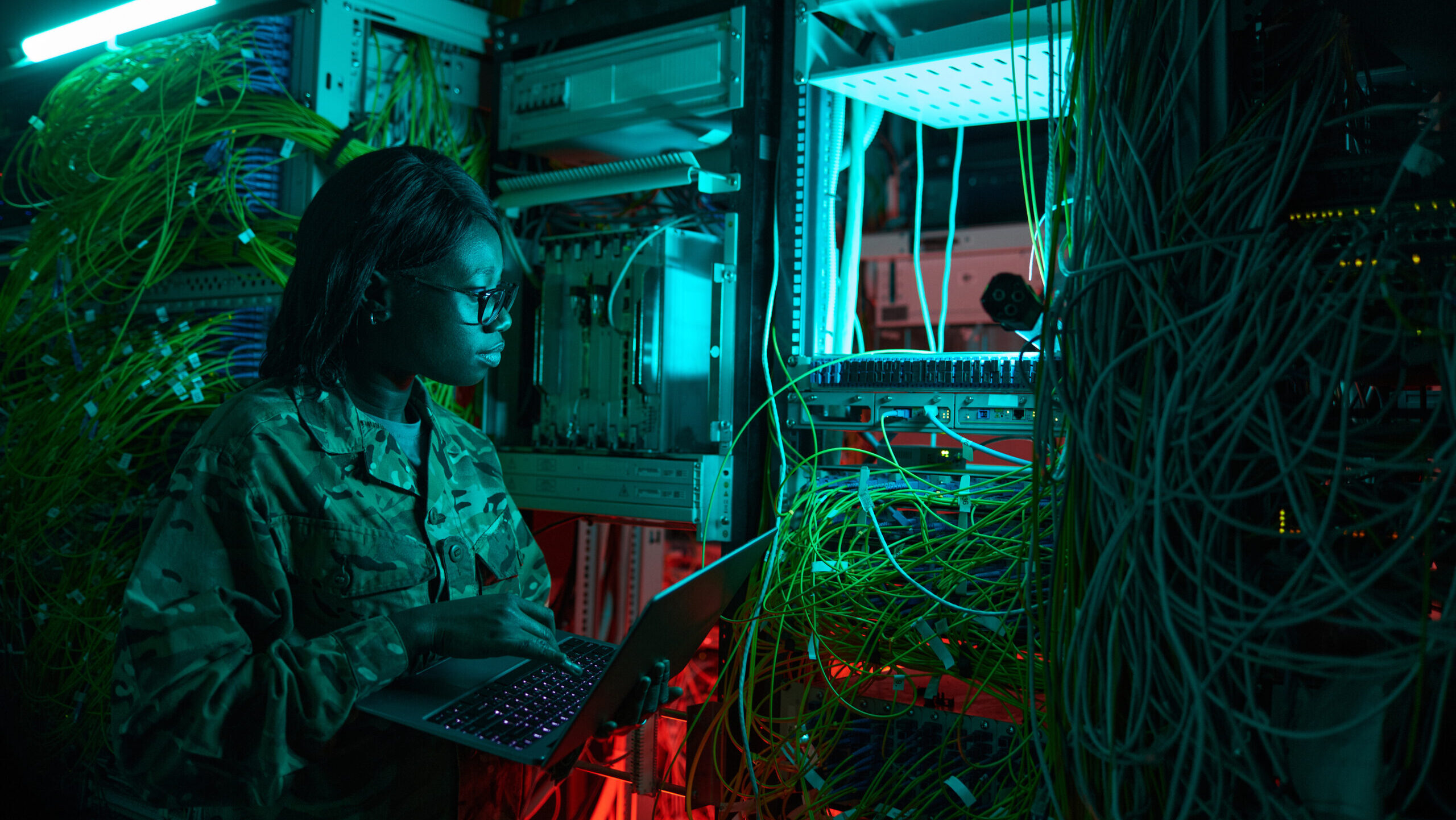hackers working in computer labs and network cables