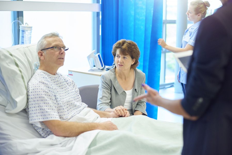 Patient recovering in a hospital bed post-surgery.