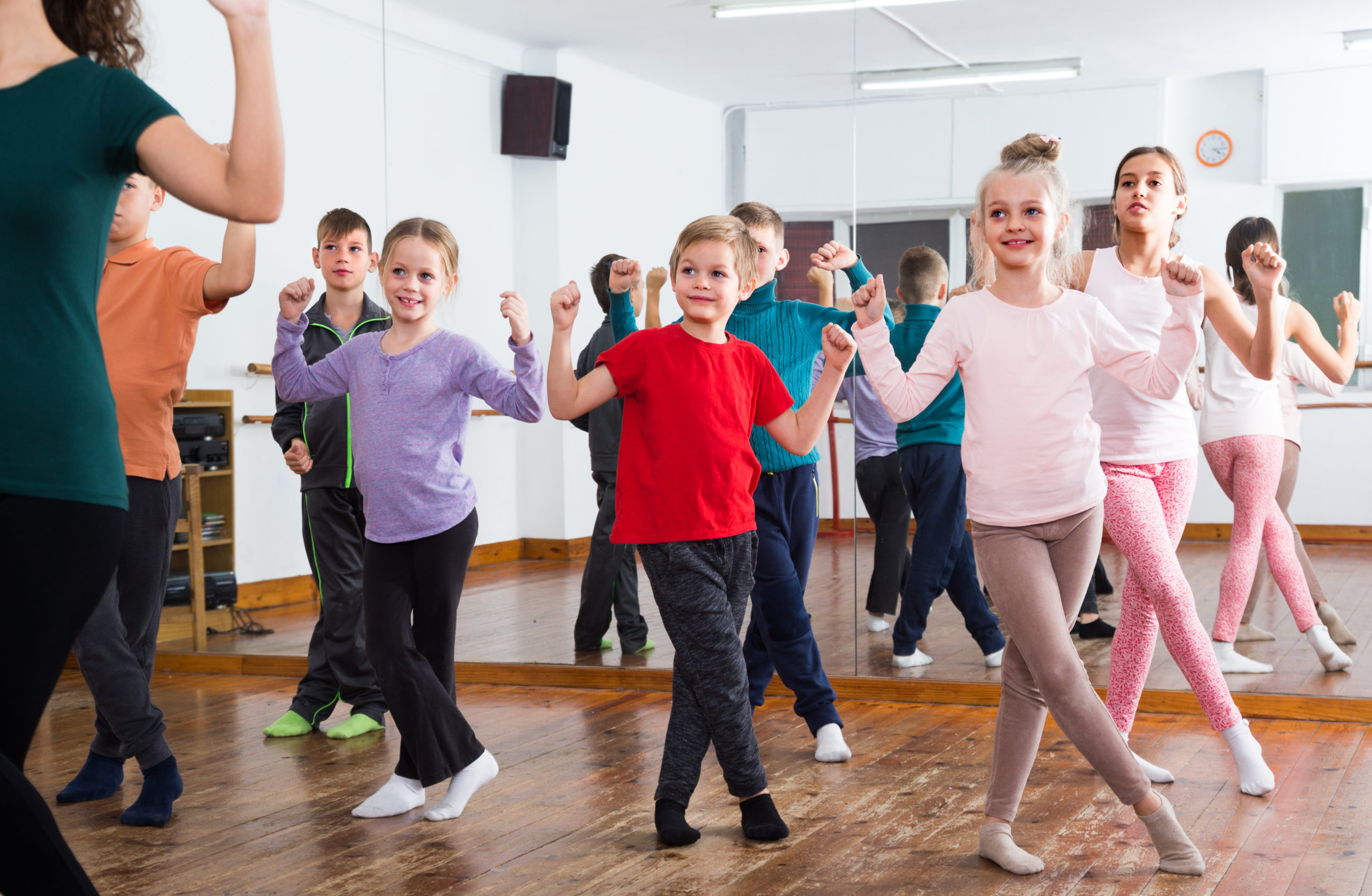 child performing group movement exercise