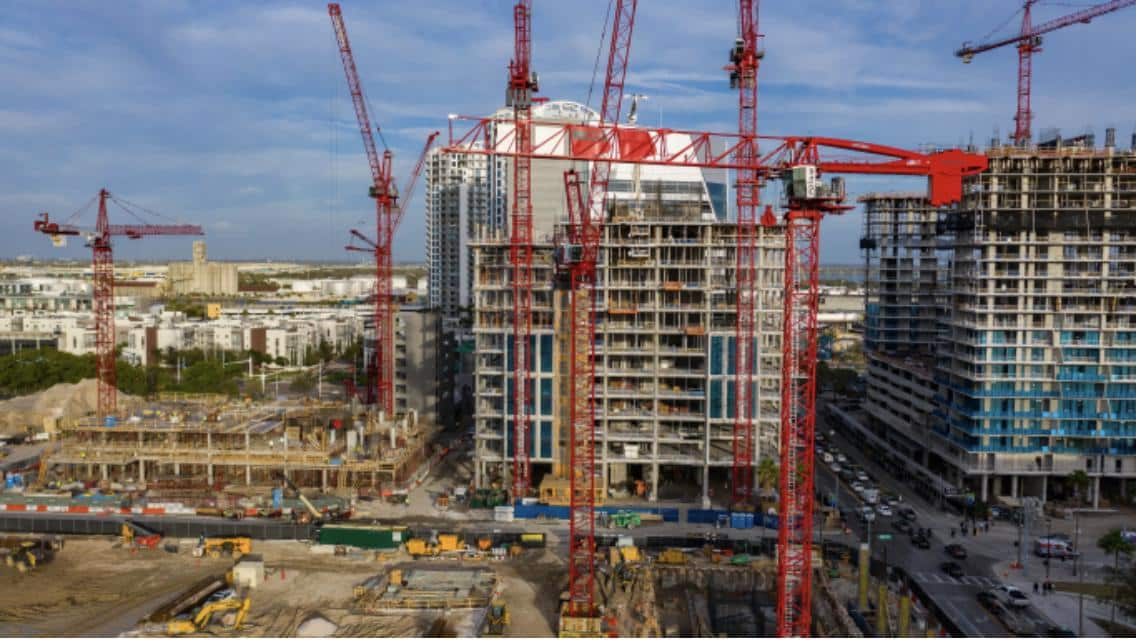 modern city infrastructure with construction cranes