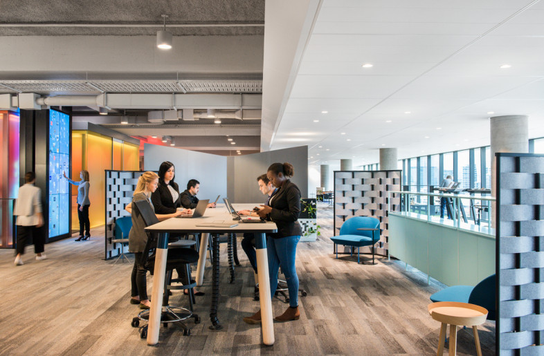 pwc office building people collaborating