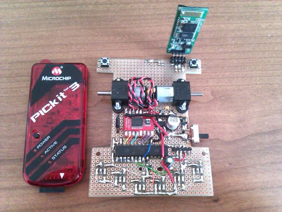 PIC33 microcontroller circuit board and oscilloscope