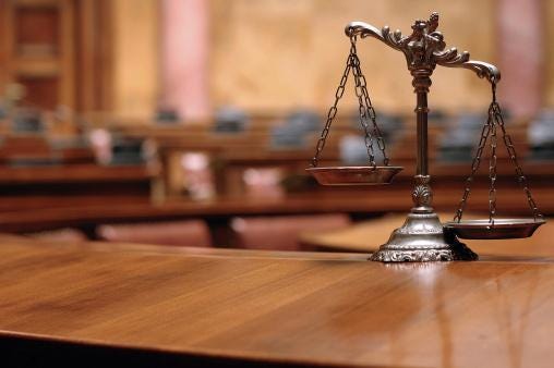 legal scale and old courtroom