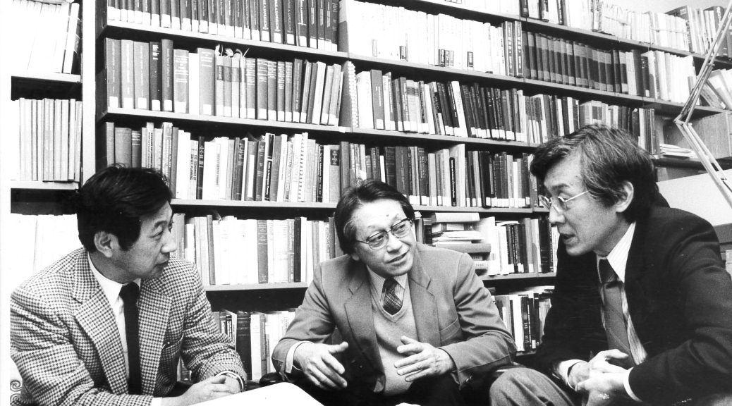researchers using notebooks in a modern library
