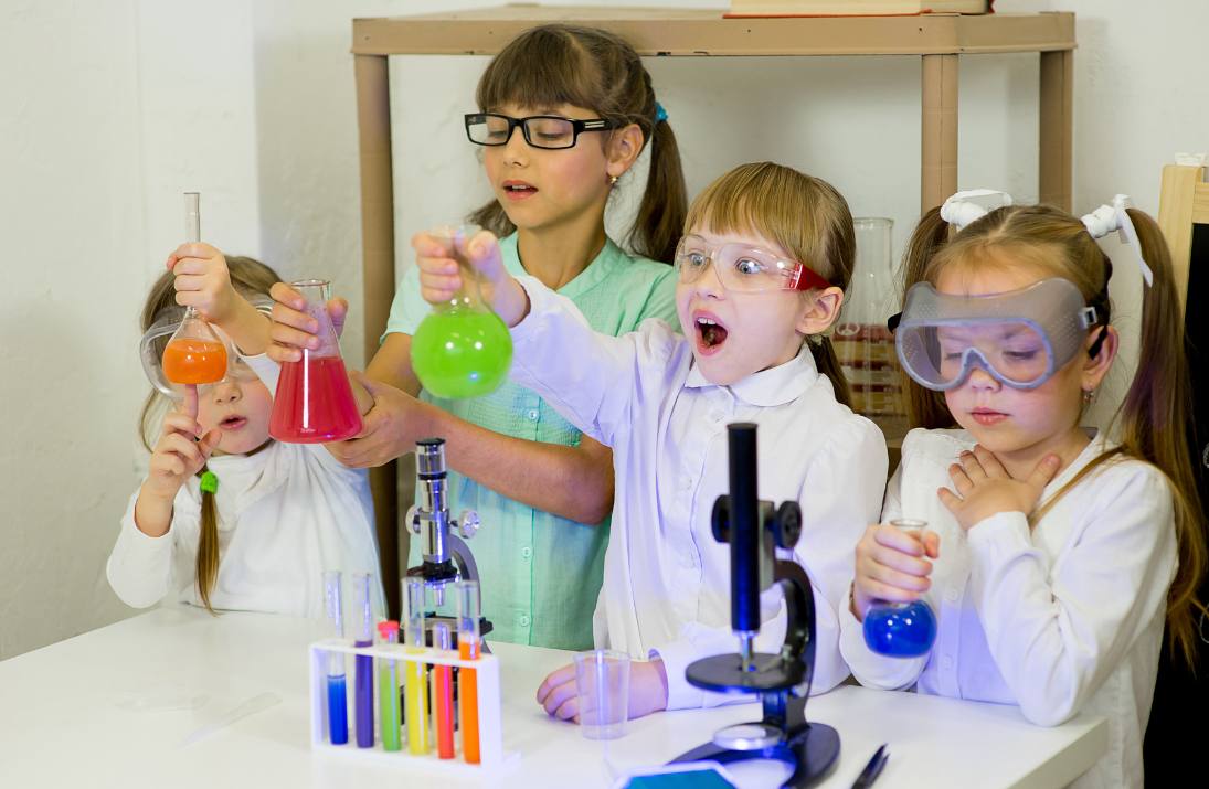 children exploring science classroom laboratory