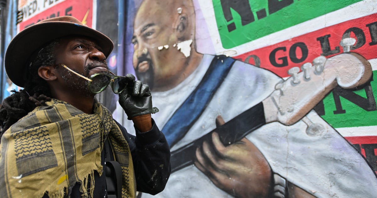 urban street protest with graffiti and rap artists performing