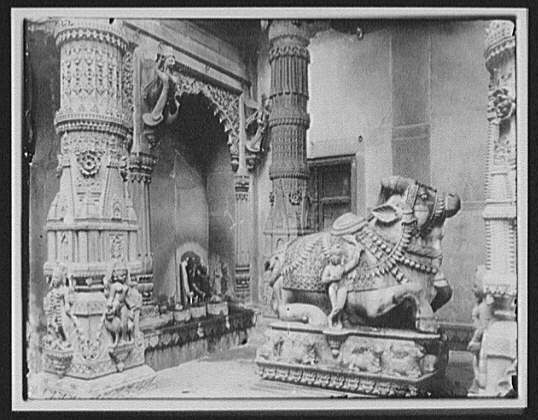 historic synagogue interior, sacred ancient texts, and Indian bull statue