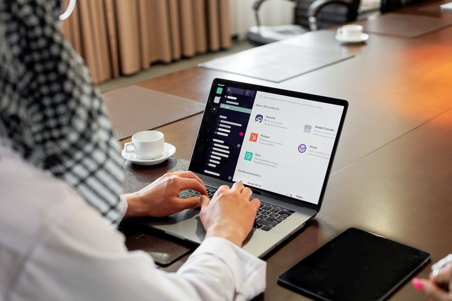 Person watching online training on a laptop