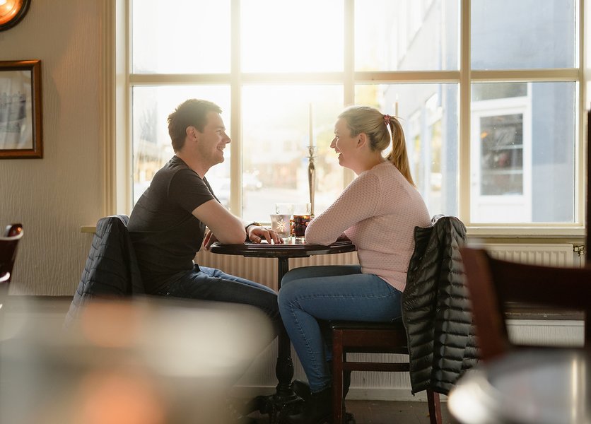 couple talking in cozy cafe