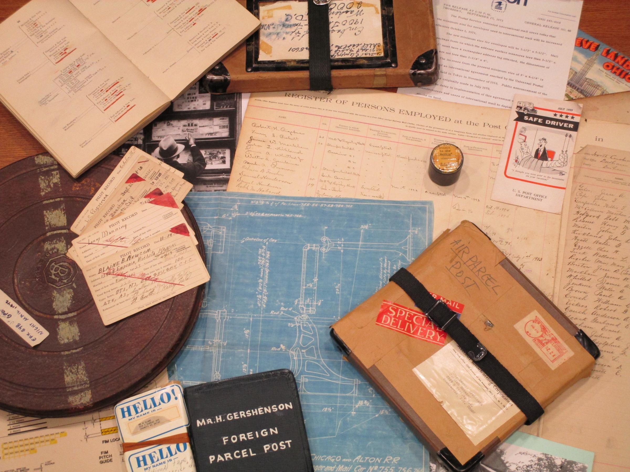 old archival photo of filatelic items and heritage documents