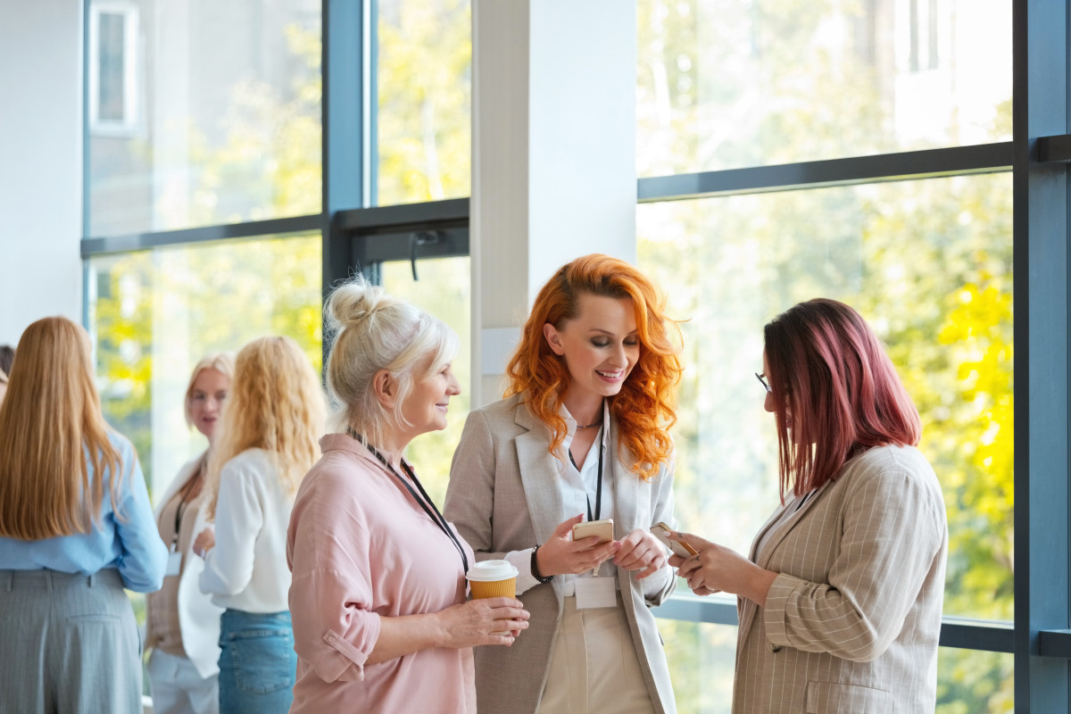 people conversing in modern setting