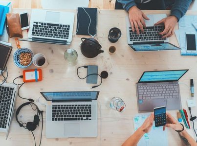 books and digital media on communication desk