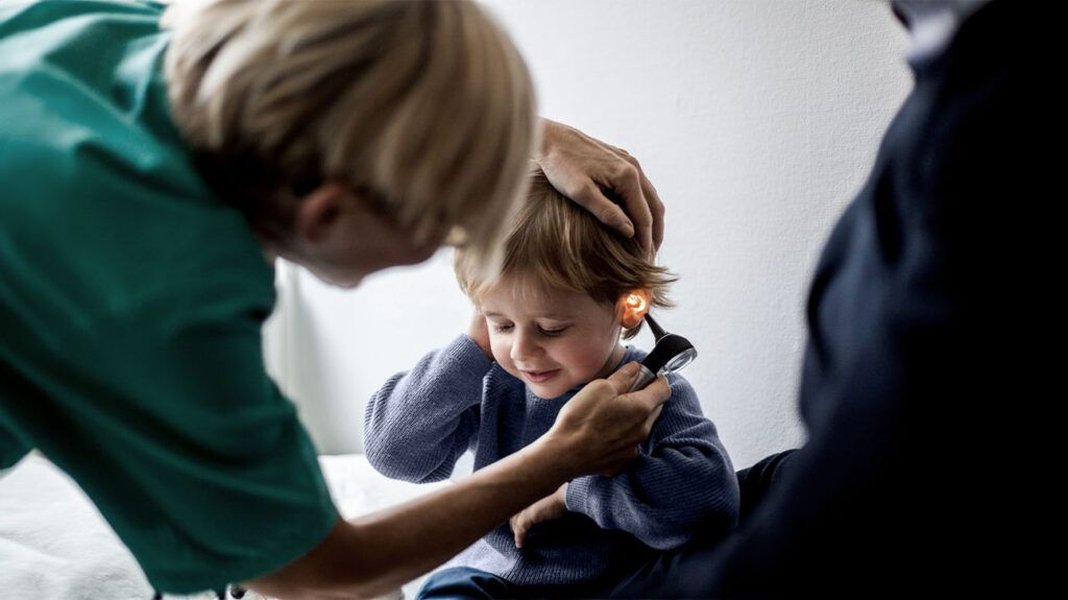doctor examining child for ADHD evaluation