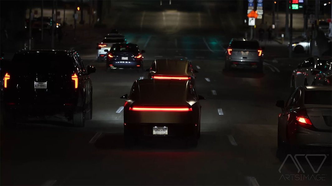 Tesla Cybercab robotaxis operating at night in Austin, Texas.