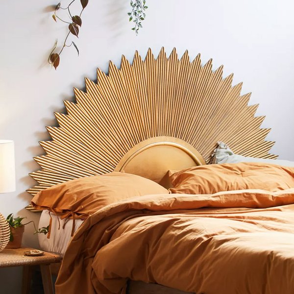 Bedroom with golden sunburst headboard
