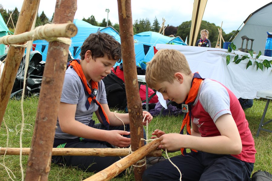 Rover Scouts working together on a team challenge