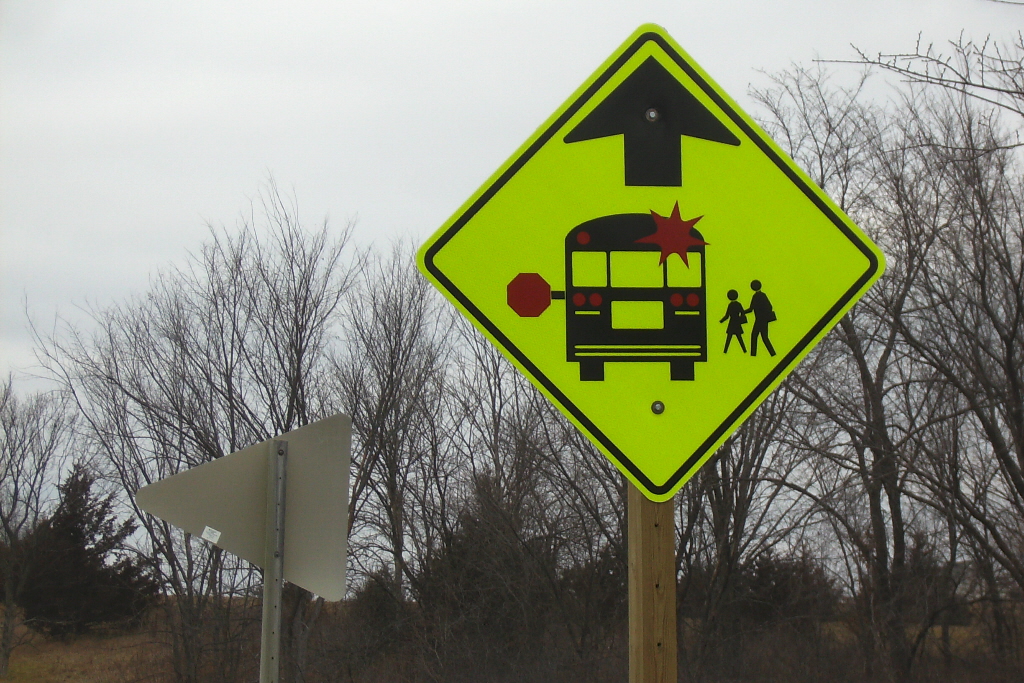 rural road signage and school bus