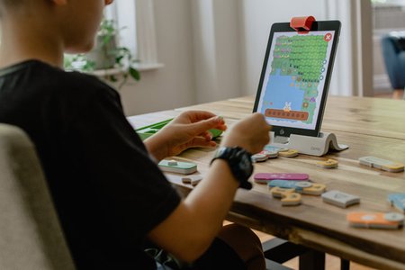 colorful scratch blocks and children using computer