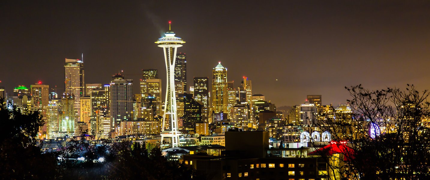 Classic Seattle skyline view from Kerry Park, featuring the Space Needle and city buildings with water in the foreground