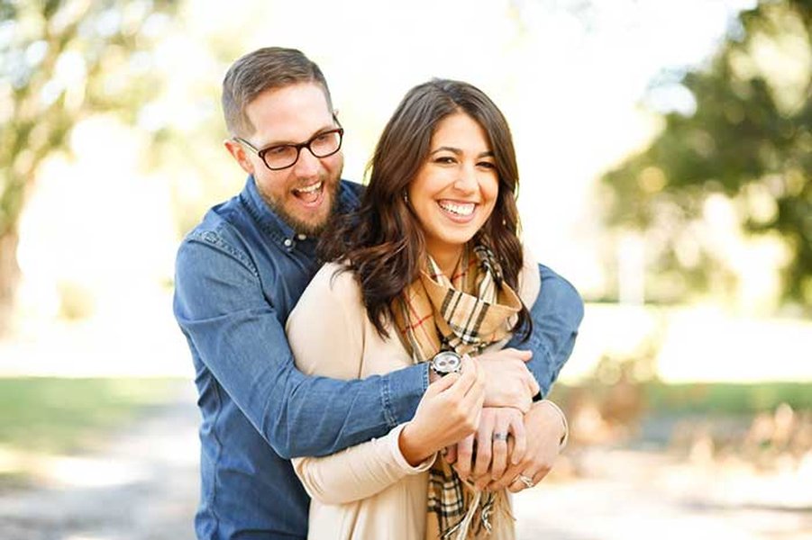 Couple walking together outdoors, looking towards the future