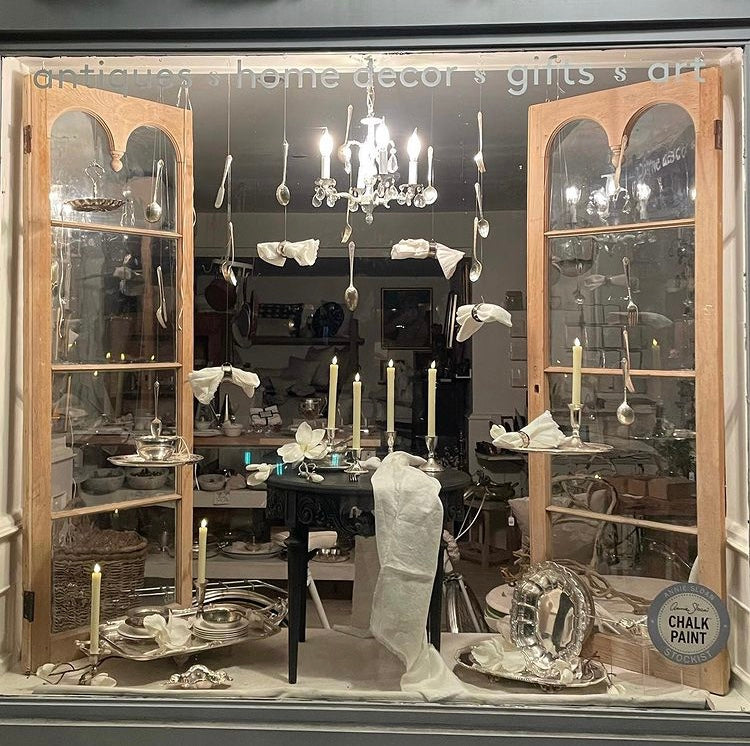 vintage shop window with antiques and memorabilia