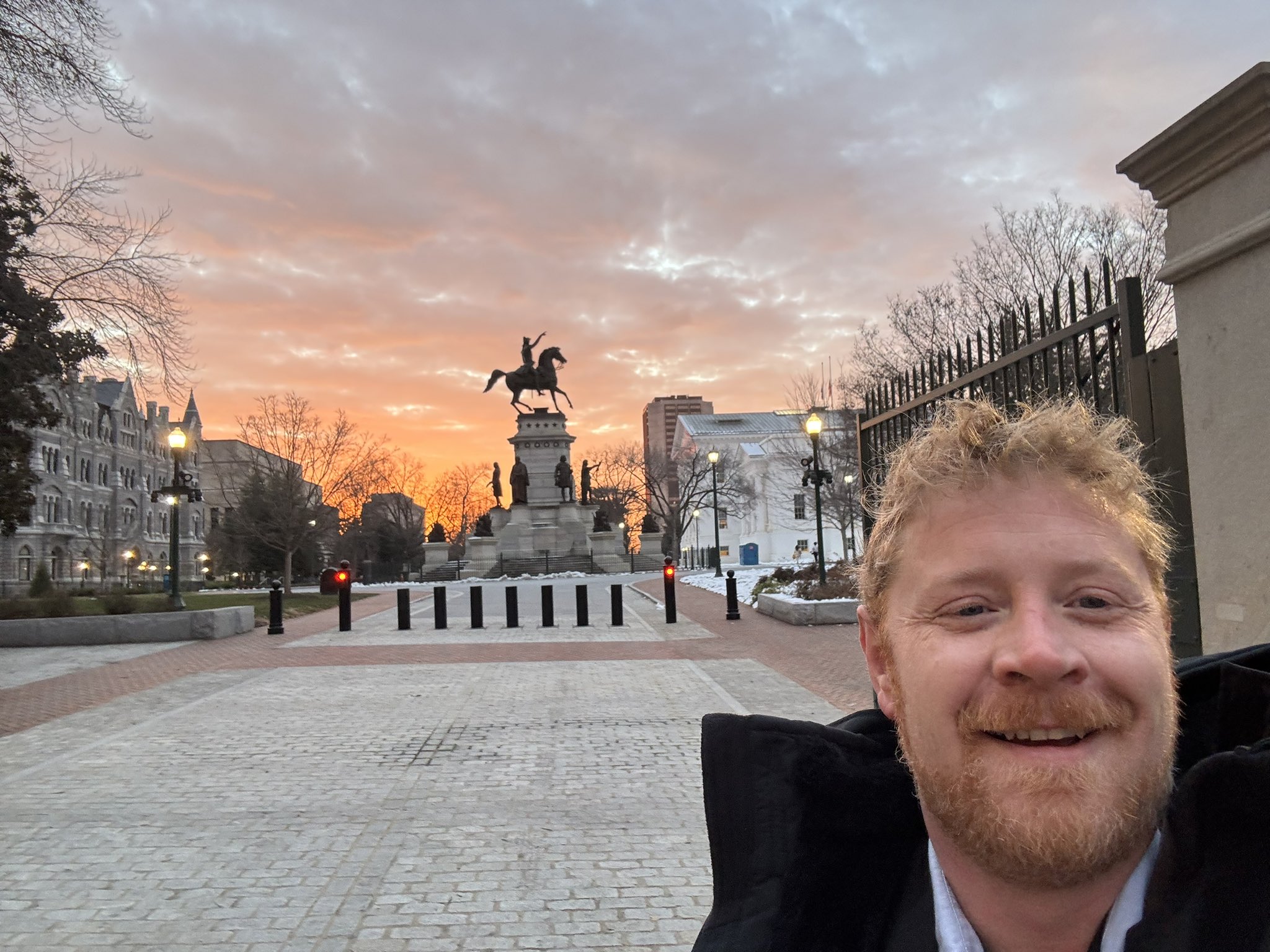 portrait of a record holder standing in a public space