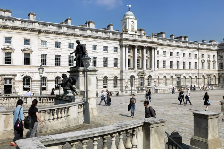 students choosing strand campus building