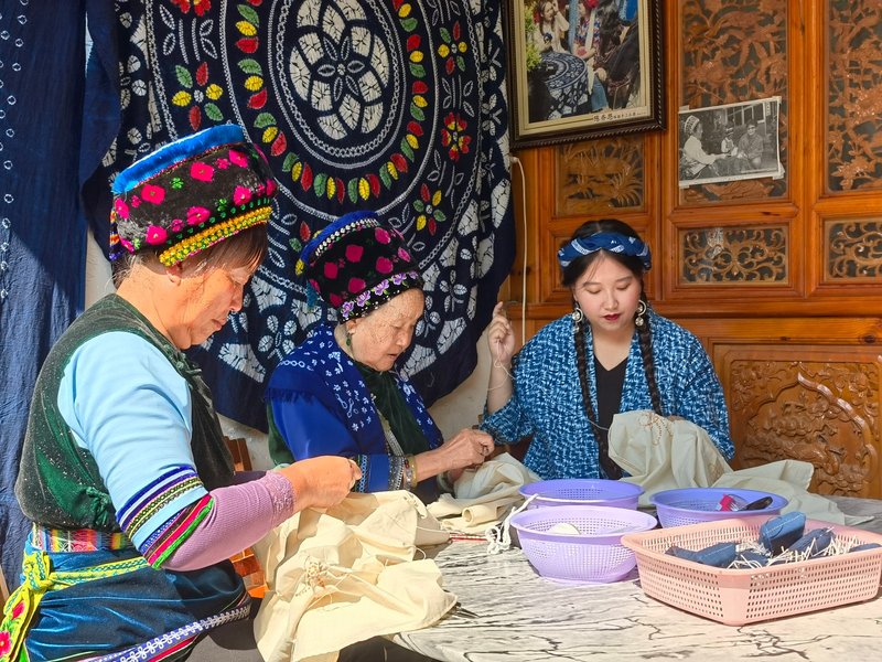 artisans pulling silk wadding traditional chinese workshop