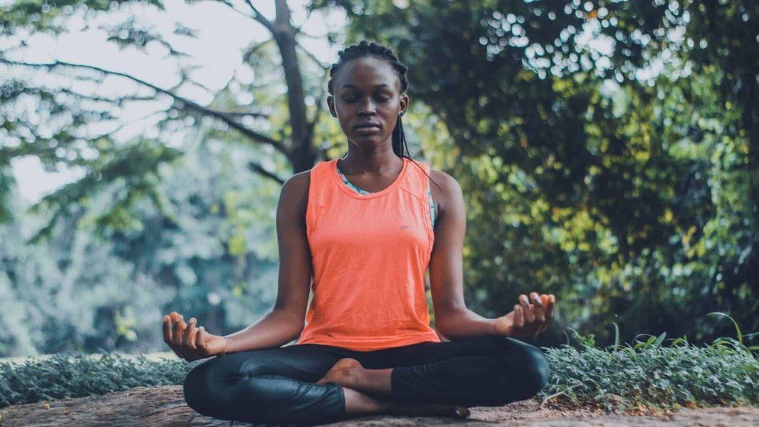 Person meditating peacefully indoors