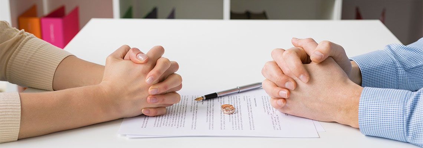 Couple signing divorce papers